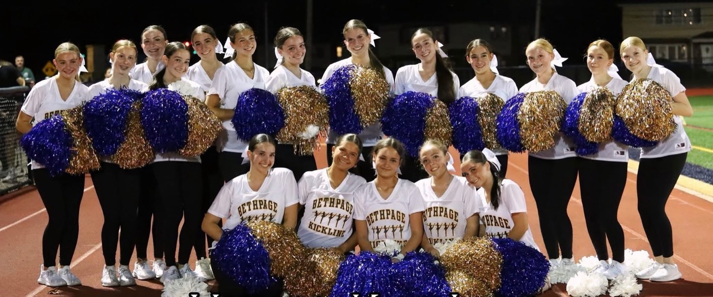 Team posing with pompoms